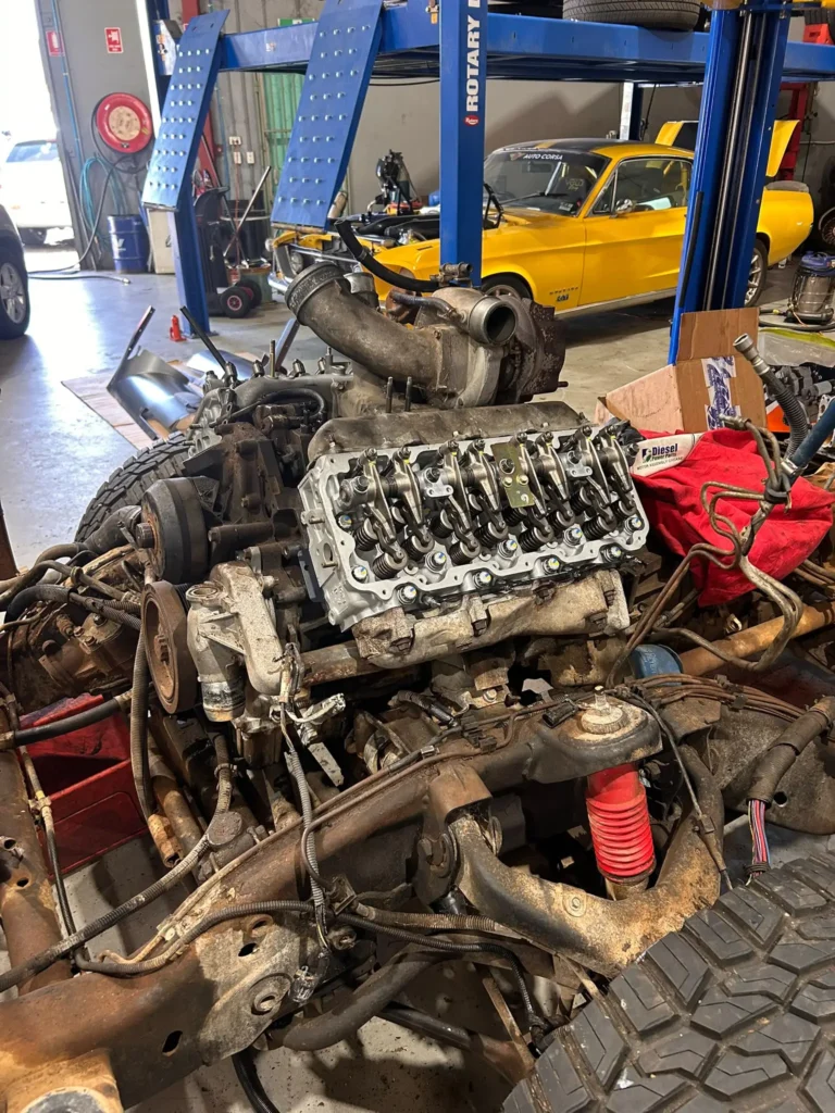 2001 LB7 Duramax 6.6L diesel with overhauled cylinder head fitted, cab off, at Welshpool Auto Service