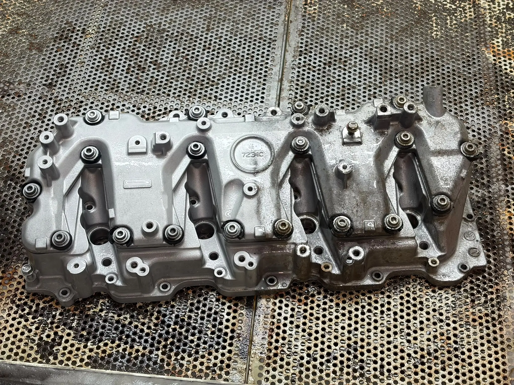 Duramax valve cover before vapour blasting, covered in baked-on oil and grime